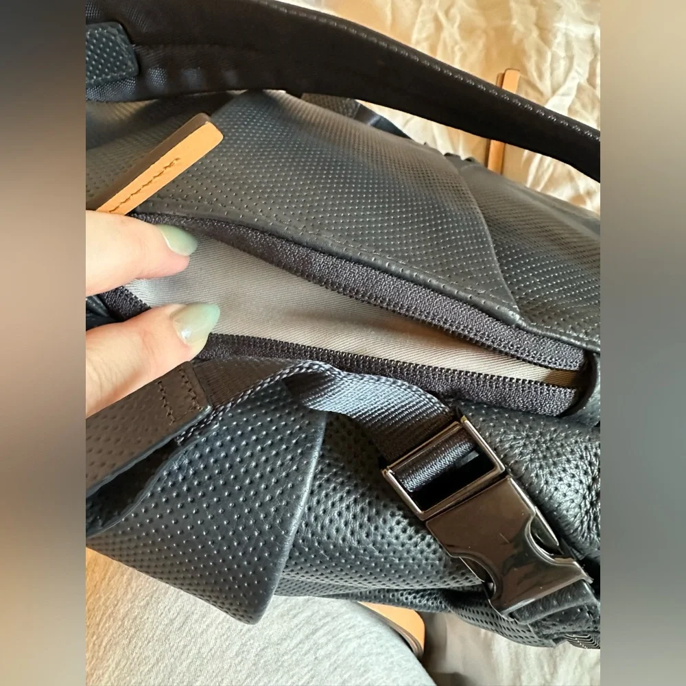 Tumi Navy Perforated Leather Backpack with Tan Handles